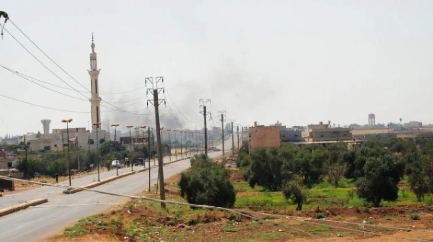 Smoke rises from a street in Daraa, Syria. Reuters file photo