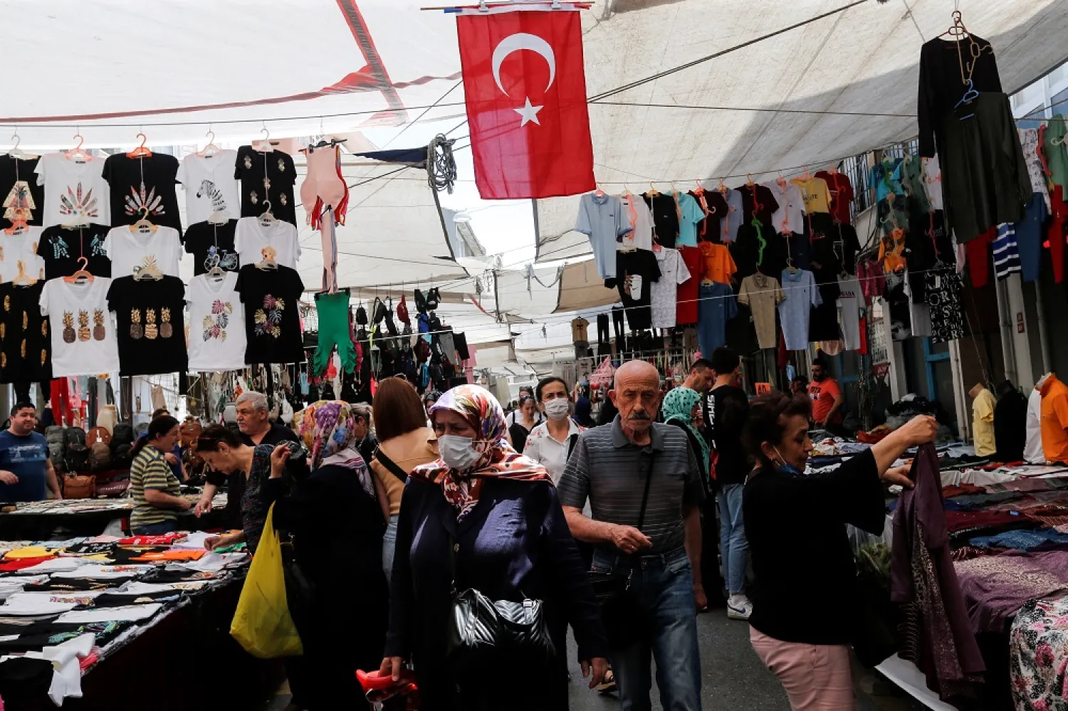 People shop at a open market in Istanbul, Turkey, June 10, 2022. (Reuters)