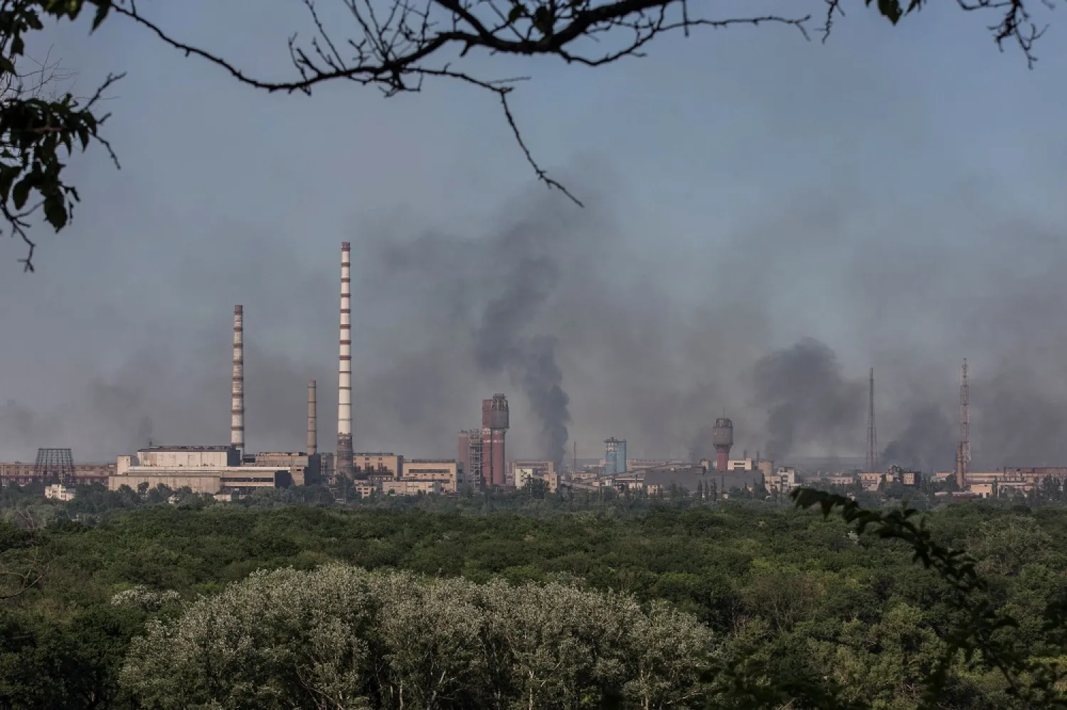 Smoke rises after a military strike on a compound of the Sievierodonetsk's Azot Chemical Plant amid Russia's attack on Ukraine continues, in the town of Lysychansk, Luhansk region, Ukraine June 10, 2022. Picture taken June 10, 2022. (Reuters)