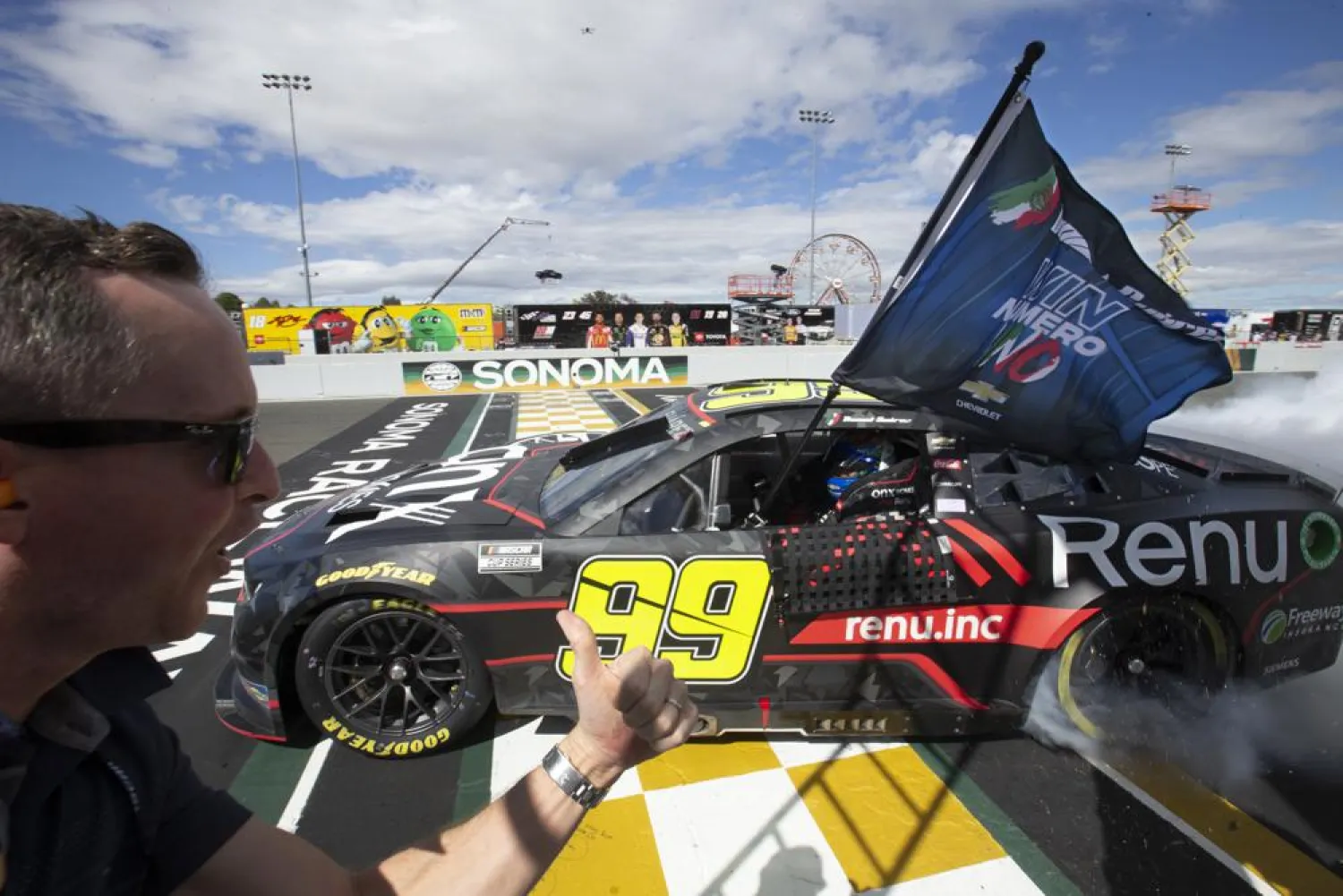 Daniel Suarez does a burnout after winning a NASCAR Cup Series auto race, Sunday, June 12, 2022, at Sonoma Raceway in Sonoma, Calif. (AP Photo/D. Ross Cameron)
