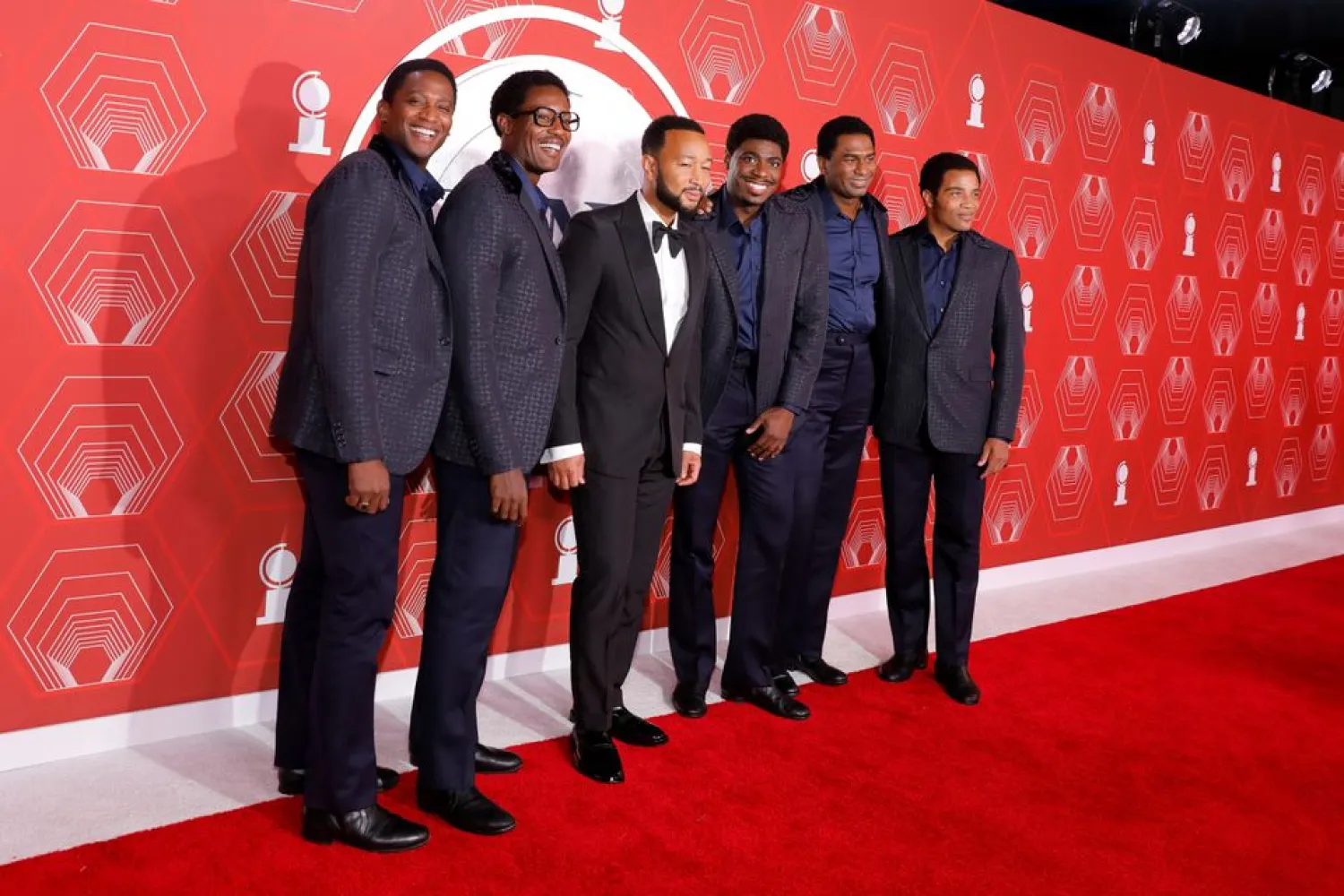 John Legend and the cast of Ain't Too Proud pose on the red carpet at the 74th Annual Tony Awards in New York, US, September 26, 2021. REUTERS/Andrew Kelly


