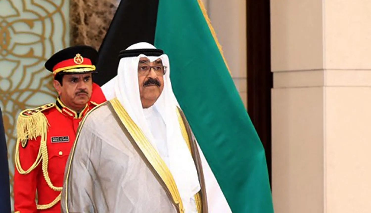 A photo provided by the Kuwaiti news agency KUNA on June 7, 2022, shows Kuwaiti Crown Prince Sheikh Meshal al-Ahmad al-Jaber al-Sabah (R) receiving his Jordanian counterpart Hussein bin Abdullah (not pictured) in Kuwait City. (KUNA/AFP)