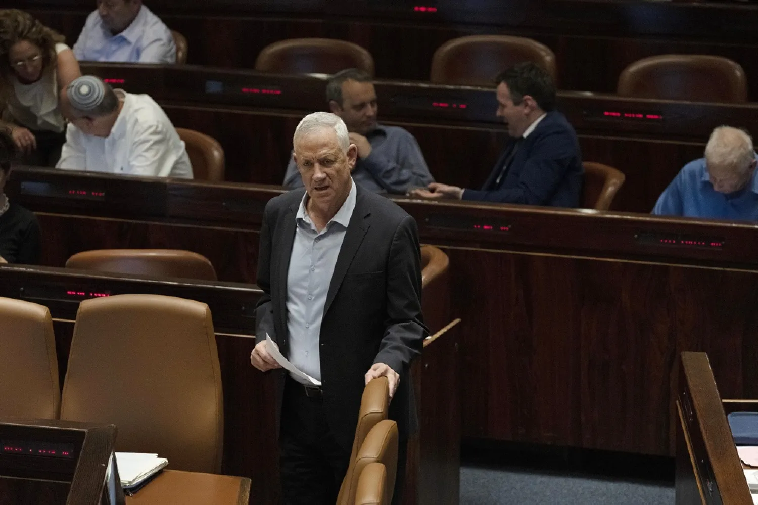 Israeli Minister of Defense Benny Gantz takes his seat during a session of the Knesset, Israel's parliament, ahead of an expected vote on the legal status of Jewish settlers in the occupied West Bank, in Jerusalem, Monday, June 6, 2022. (AP)