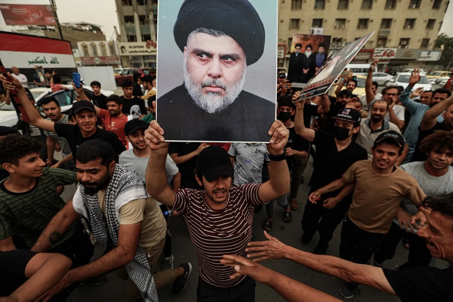 26 May 2022, Iraq, Baghdad: Supporters of Iraqi cleric Moqtada al-Sadr take part in a rally at Tahrir Square after the Iraqi parliament approved a bill banning normalization with Israel. (dpa)