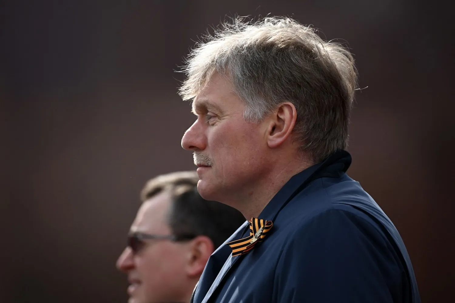 Kremlin spokesman Dmitry Peskov waits to watch the Victory Day military parade at Red Square in central Moscow on May 9, 2022. (AFP)