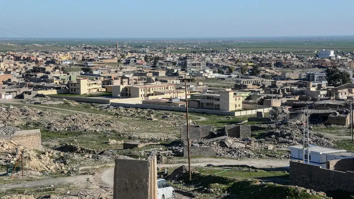 A file photo taken on February 4, 2019, shows a general view of damaged buildings in the northern Iraqi town of Sinjar. (AFP)