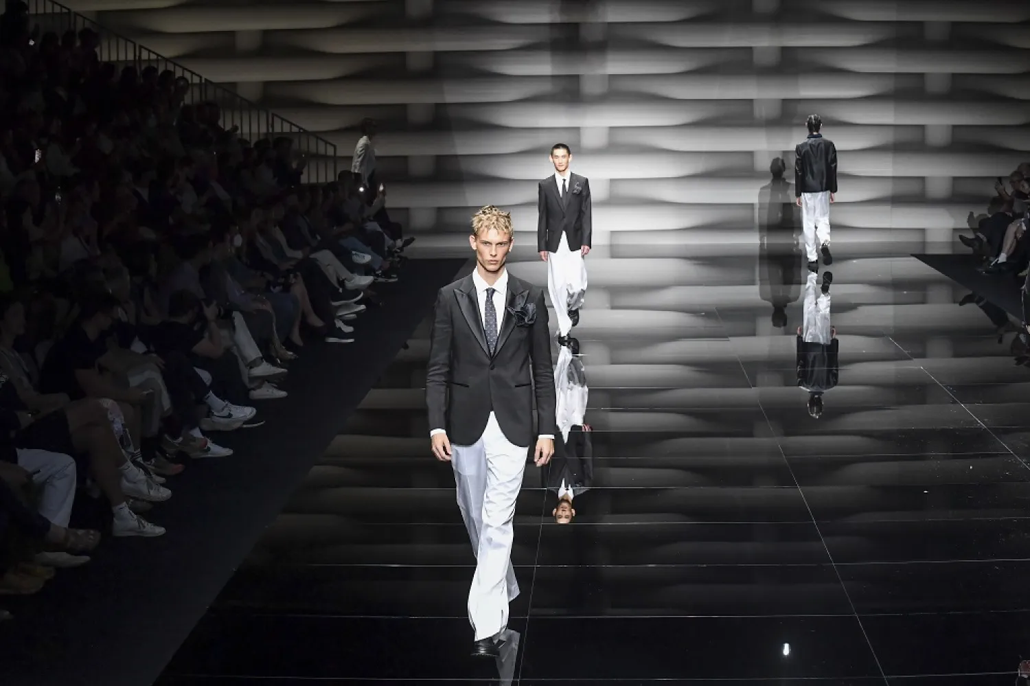 A model wears a creation as part of the Emporio Armani men's Spring Summer 2023 collection presented in Milan, Italy, Saturday, June 18, 2022. (AP)
