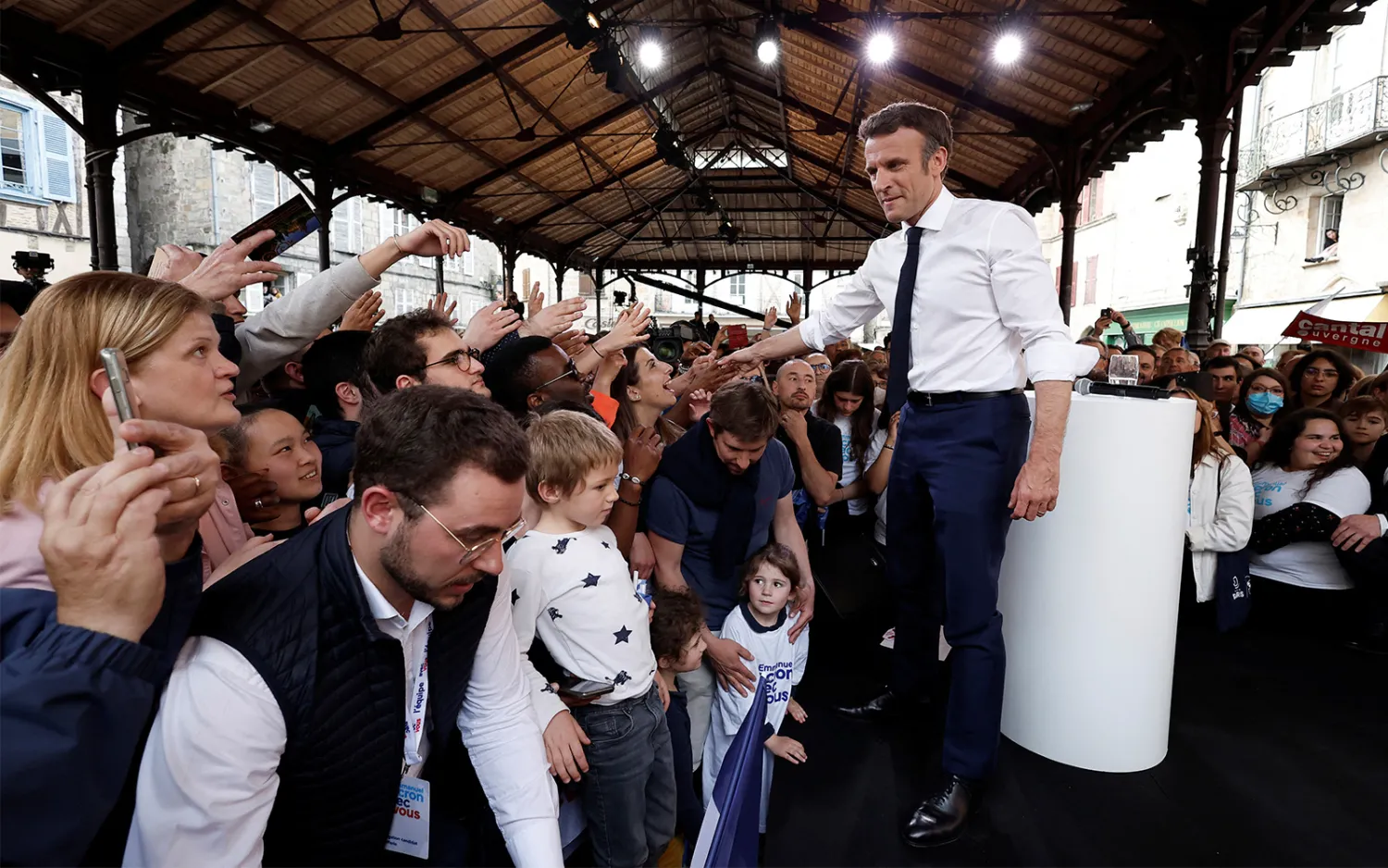 French President Emmanuel Macron shakes hands with supporters after a campaign rally Friday, April 22, 2022 in Figeac, southwestern France. (Benoit Tessier, Pool via AP)