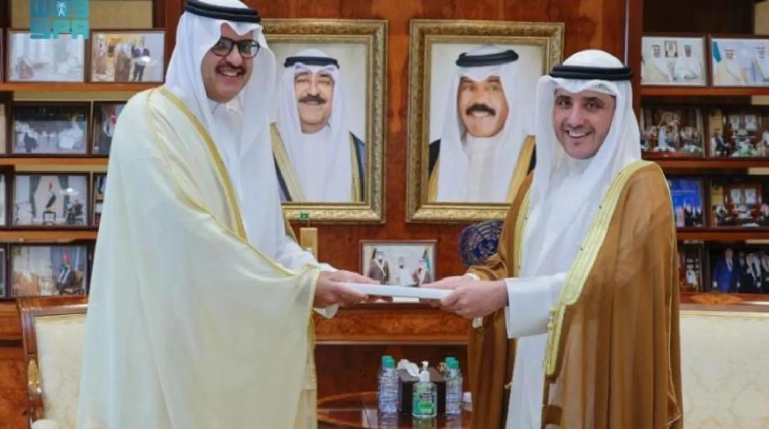 The Saudi Ambassador to Kuwait hands over the letter to the Kuwaiti Foreign Minister. SPA