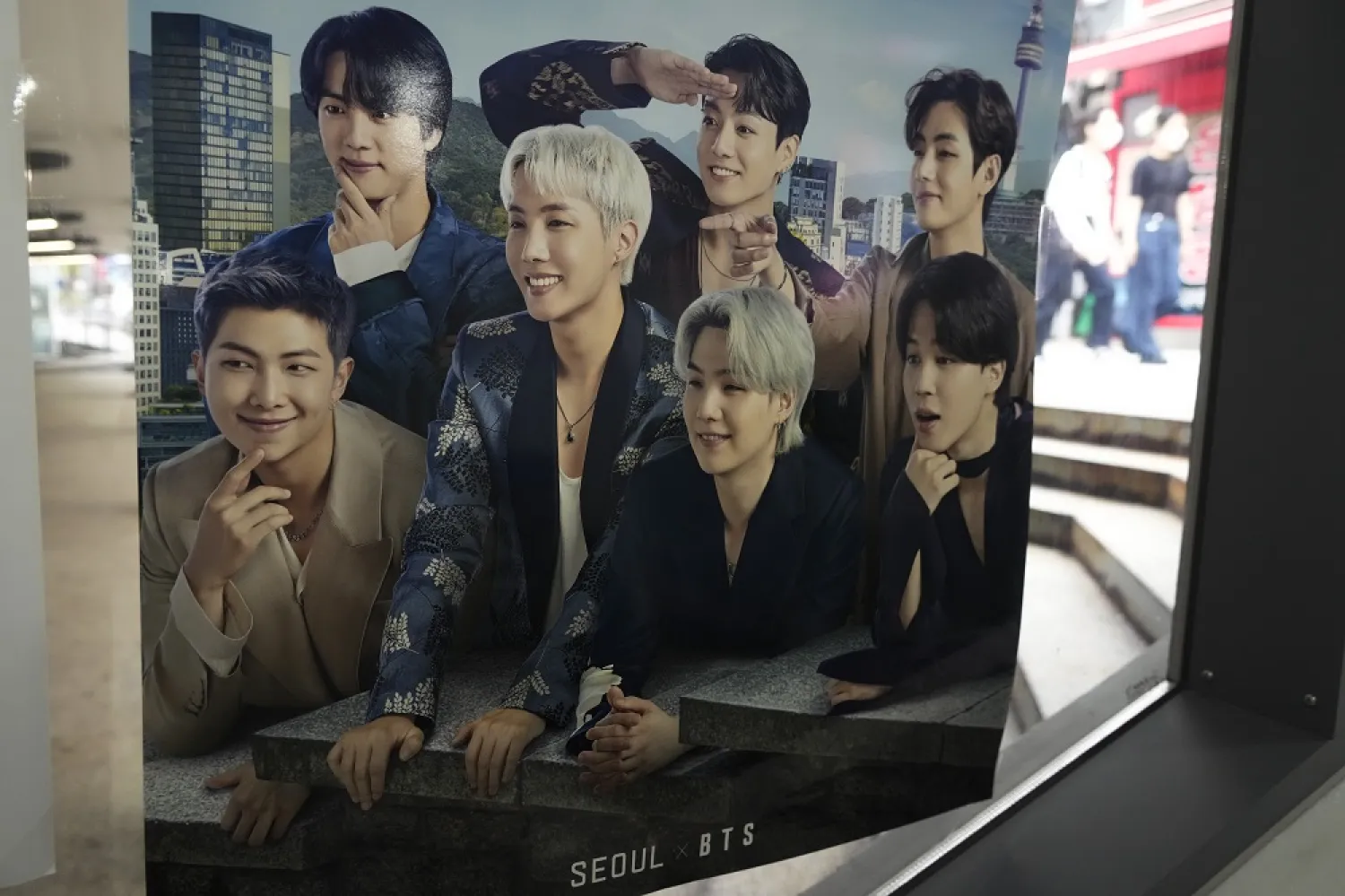 A poster showing K-pop group BTS members is displayed at a tourist information center in Seoul, South Korea, Wednesday, June 15, 2022. (AP)