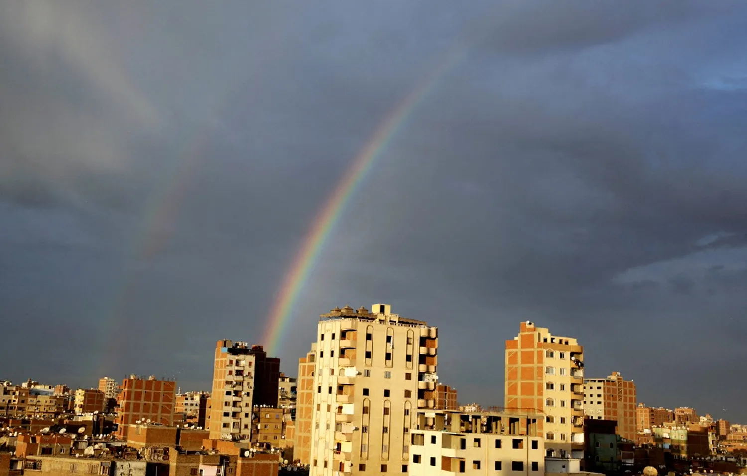 A rainbow is seen in the sky after a heavy rain in Cairo, Egypt February 19, 2022. (Reuters)