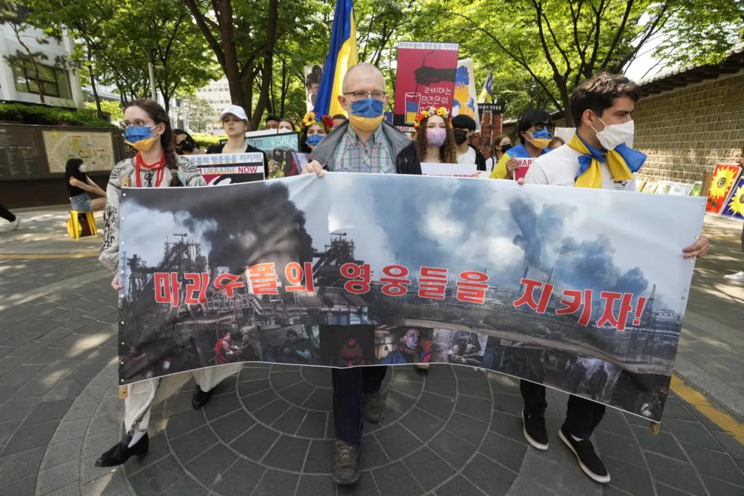 People march during a rally against Russia's invasion of Ukraine near the Russian Embassy in Seoul, South Korea, May 22, 2022. (AP)
