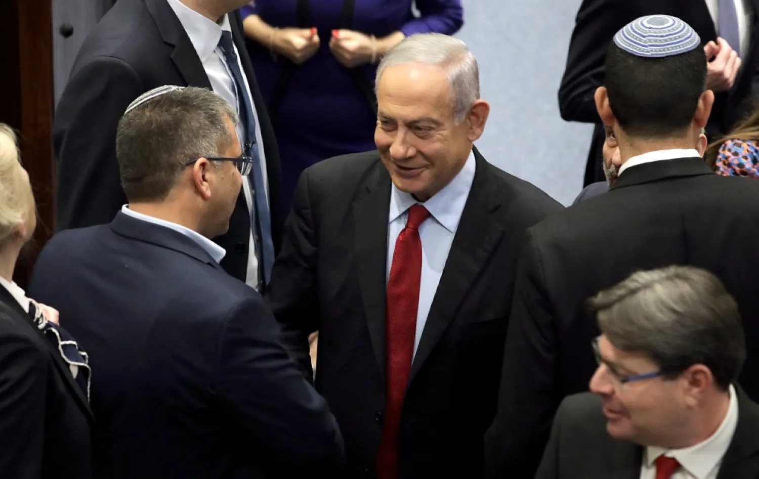 Leader of the opposition and former Israeli Prime Minister Benjamin Netanyahu (C) attends a voting session to dissolve the government in the Knesset Plenum, the Israeli Parliament, in Jerusalem, Israel, 22 June 2022. (EPA)