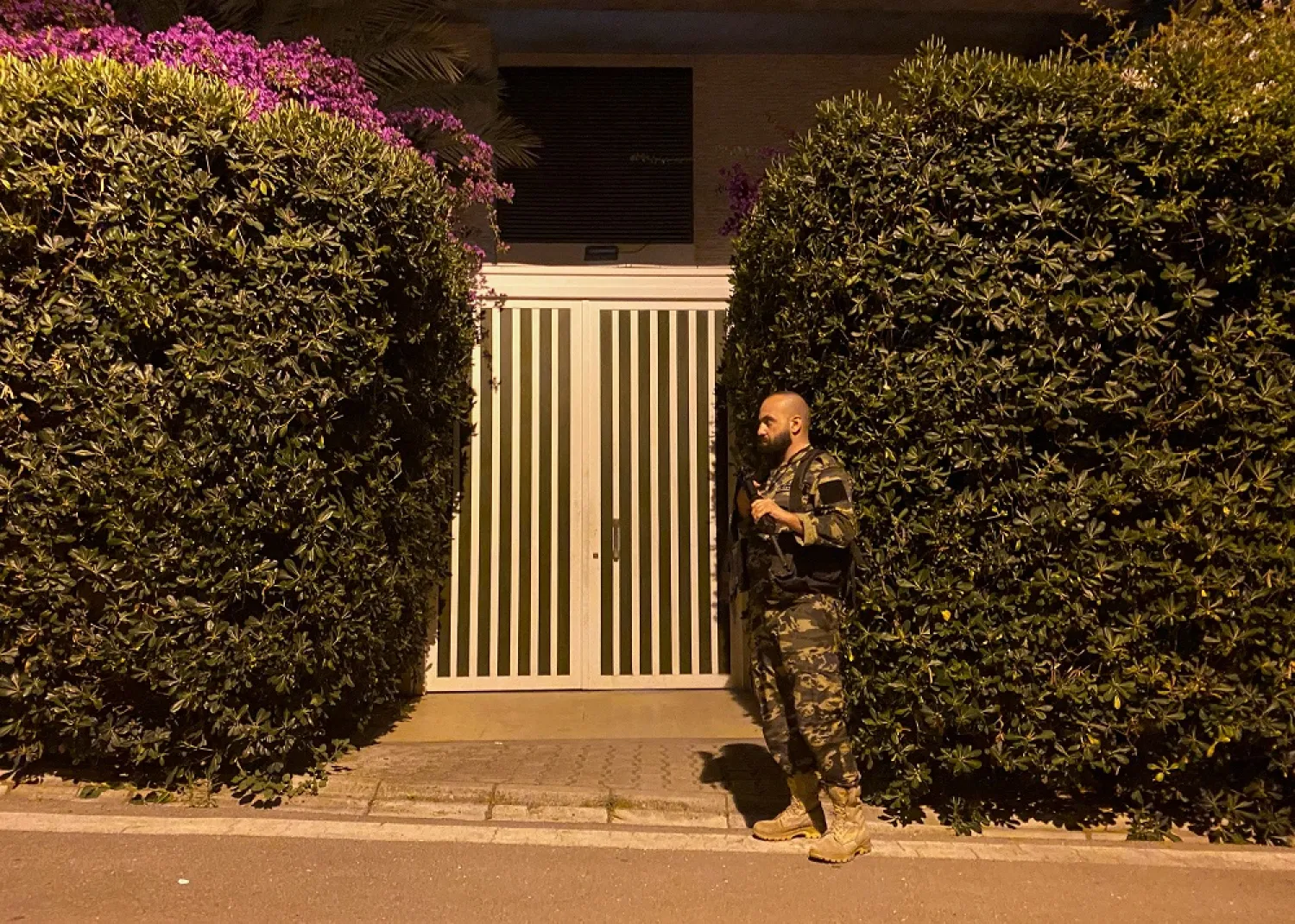 A member of Lebanese security forces stands near a house belonging to central bank Governor Riad Salameh, in Rabieh, Lebanon June 21, 2022. (Reuters)