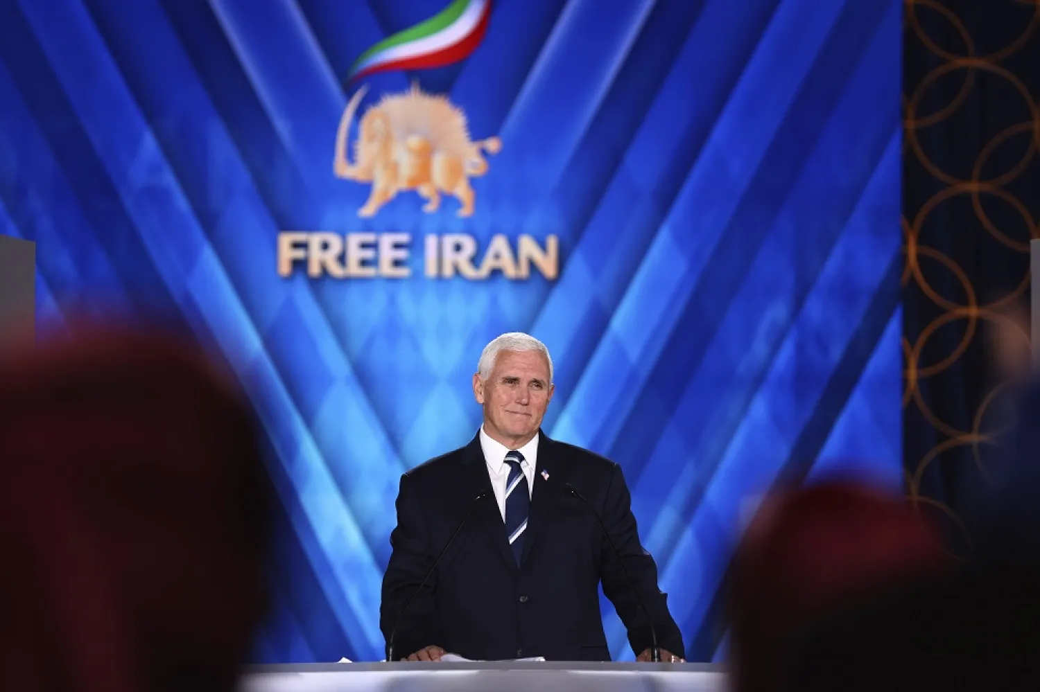 Former US Vice President Mike Pence pauses during his speech at the Iranian opposition headquarters in Albania, where up to 3,000 MEK members reside at Ashraf-3 camp in Manza town, about 30 kilometers (16 miles) west of Tirana, Albania, Thursday, June 23, 2022. (AP) 