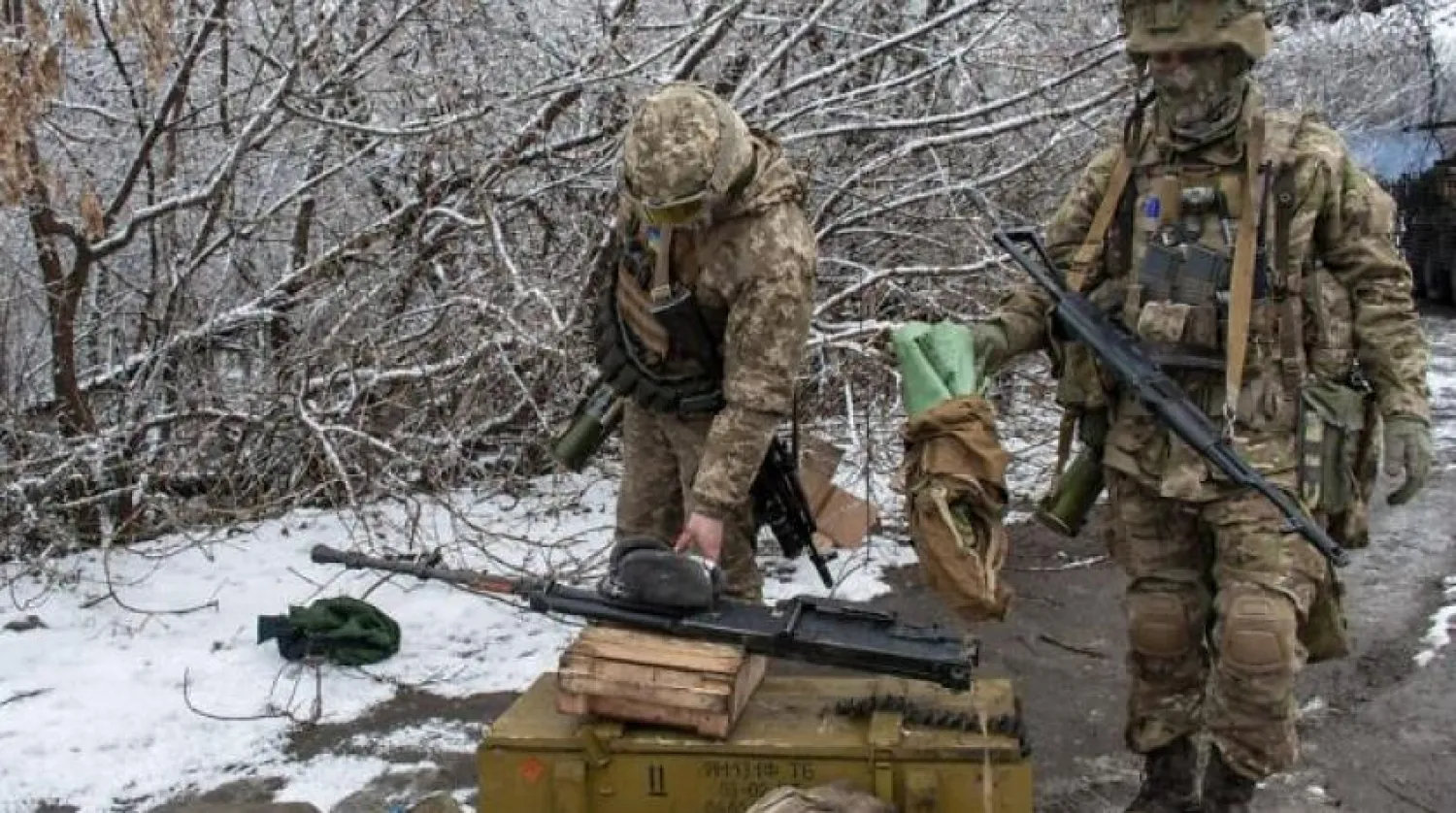 Ukrainian soldiers handle equipment outside Kharkiv, Ukraine, on Saturday, February 26, 2022. (AP Photo/Andrew Marienko)
