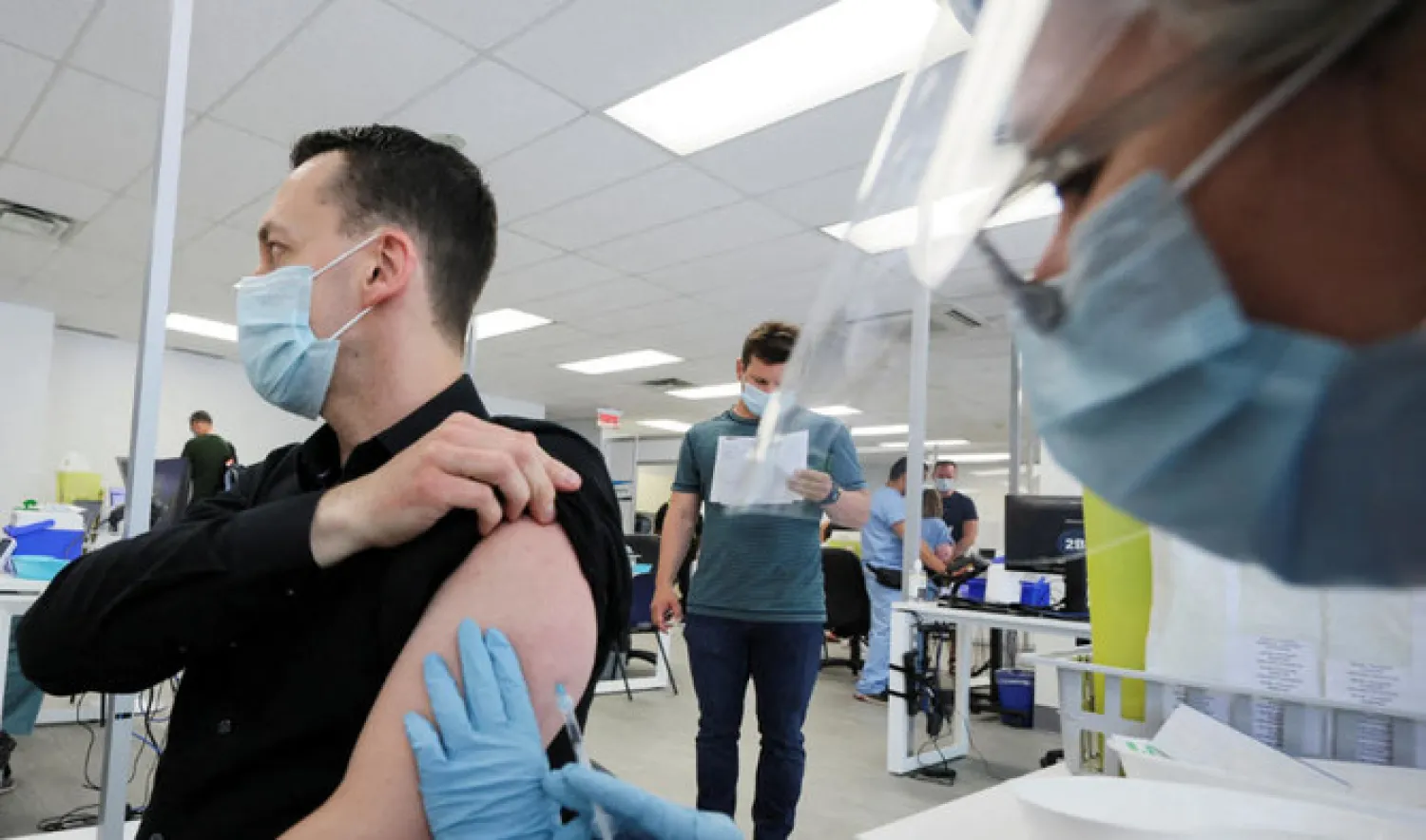 A man is vaccinated at a monkeypox vaccination clinic run by CIUSSS public health authorities in Montreal, Quebec, Canada, June 6, 2022. (REUTERS)
