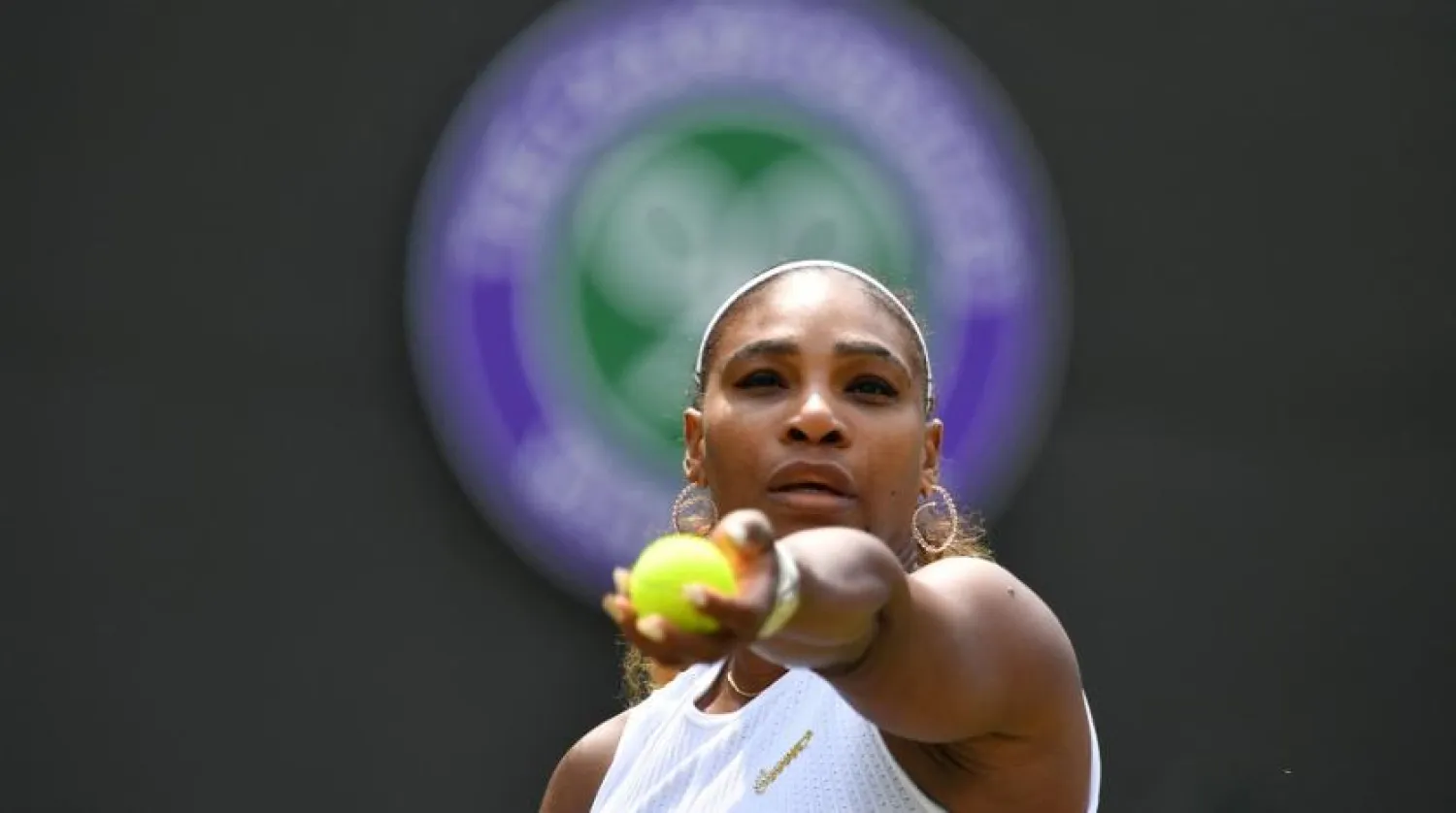 In this file photo taken on July 8, 2019 US player Serena Williams serves against Spain's Carla Suarez Navarro during their women's singles fourth-round match on the seventh day of the 2019 Wimbledon Championships at The All England Lawn Tennis Club in Wimbledon, southwest London. (AFP)
