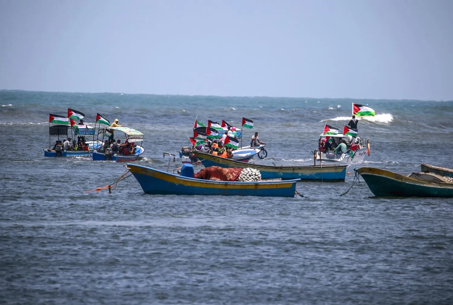 Palestinian prepare to release into air and sea messages against the Israeli siege imposed on the Gaza Strip, 22 June 2022. (EPA)