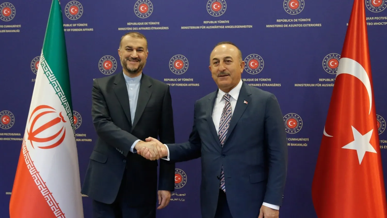 Turkish Foreign Minister Mevlut Cavusoglu (R) shakes hands with Iranian Foreign Minister Hossein Amir-Abdollahian (L) during their meeting in Ankara, Turkey, 27 June 2022. (EPA)