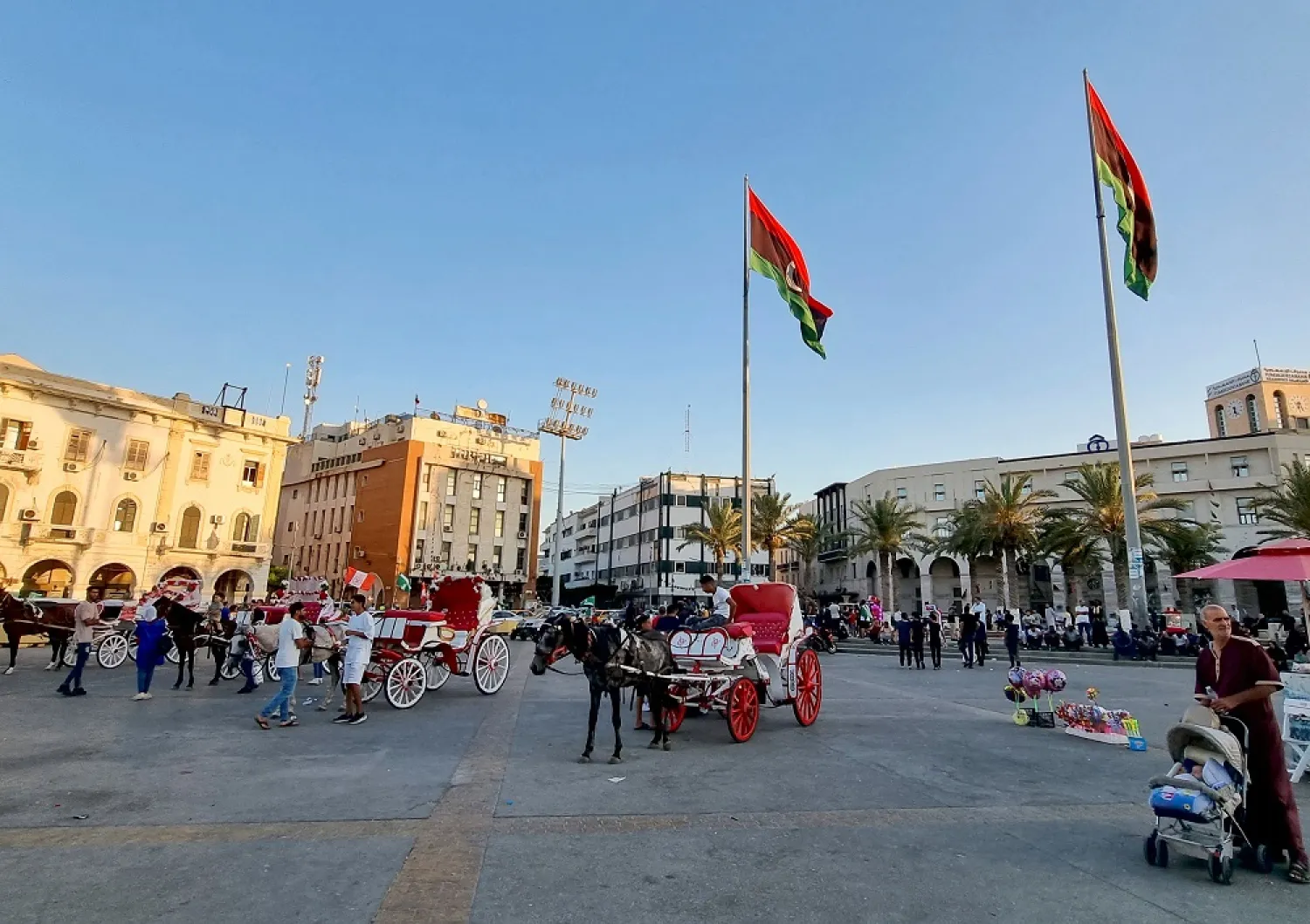 Libyans take carriage rides by the seaside in the capital Tripoli, on June 17, 2022. (AFP)