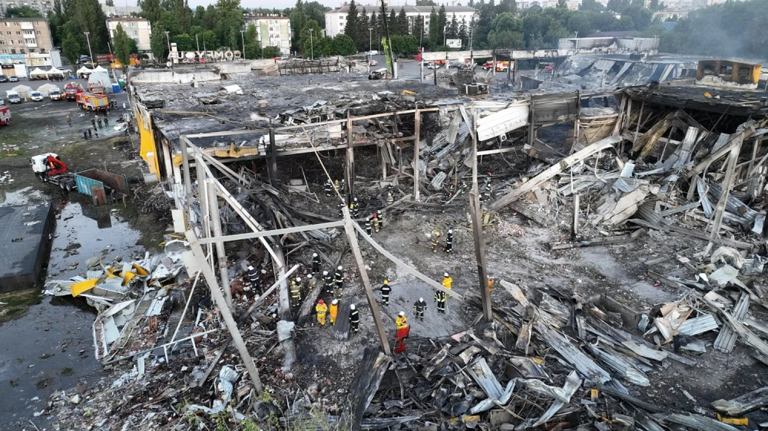 This handout picture taken and released by the Ukraine's State Emergency Service on June 28, 2022 shows rescuers working in the wreckage of a mall in Kremenchuk, the day after it was hit by a Russian missile strike according to Ukrainian authorities. (Ukrainian State Emergency Service Press Service / AFP)