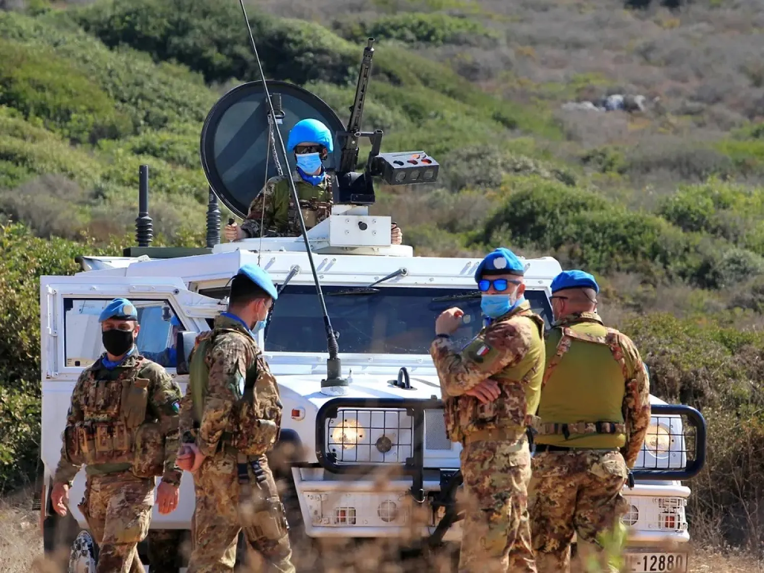 UN peacekeepers (UNIFIL) stand near a UN vehicle in Naqoura, southern Lebanon, Oct. 14, 2020. (Reuters)