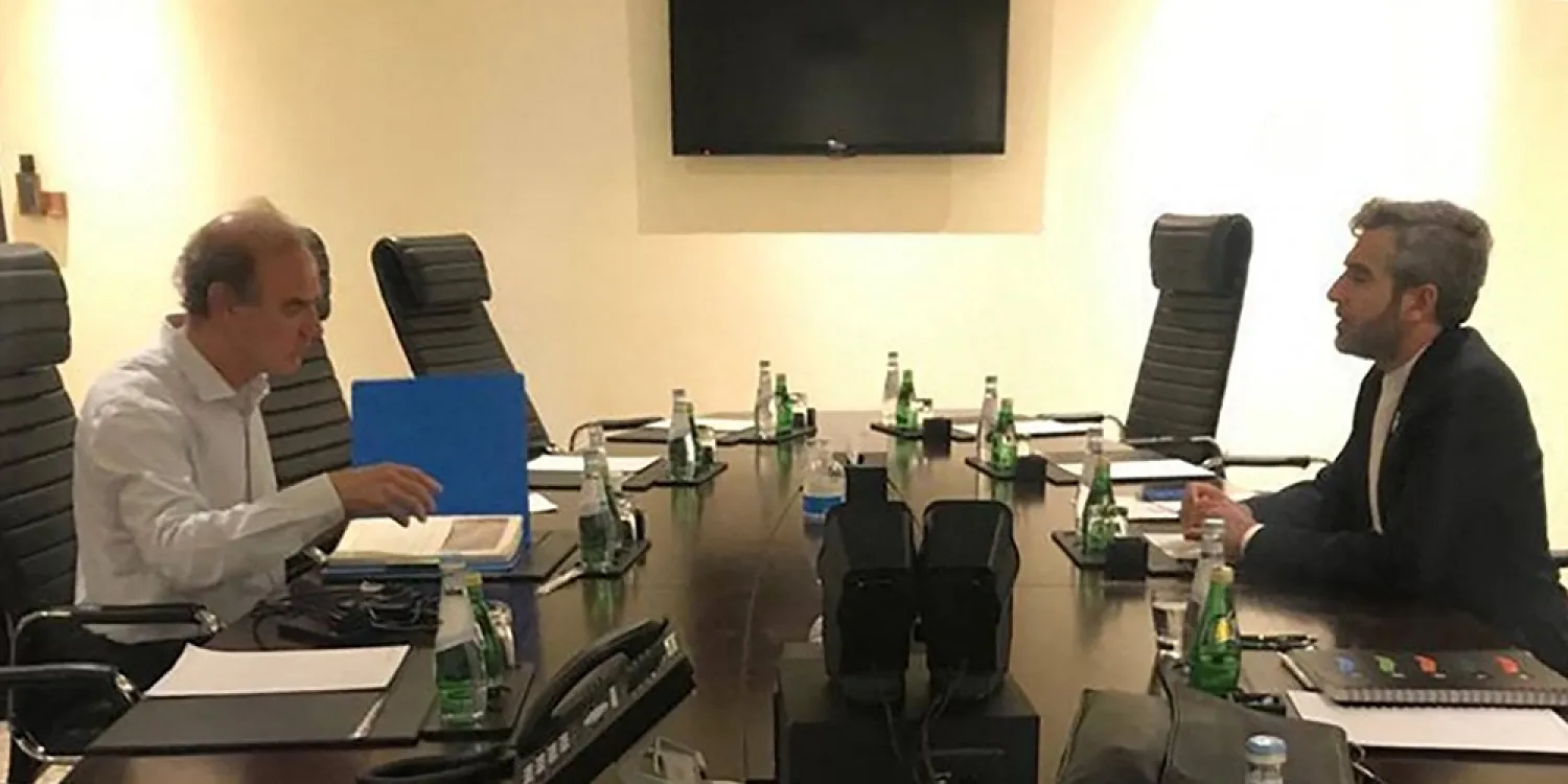 This handout photo provided by the Iranian news agency IRNA on June 28, 2022 shows (R to L) Iran's chief nuclear negotiator Ali Bagheri Kani meeting with the European Union's nuclear talks coordinator Enrique Mora in Qatar's capital Doha. (AFP/IRNA/Akbar Tavakoli)