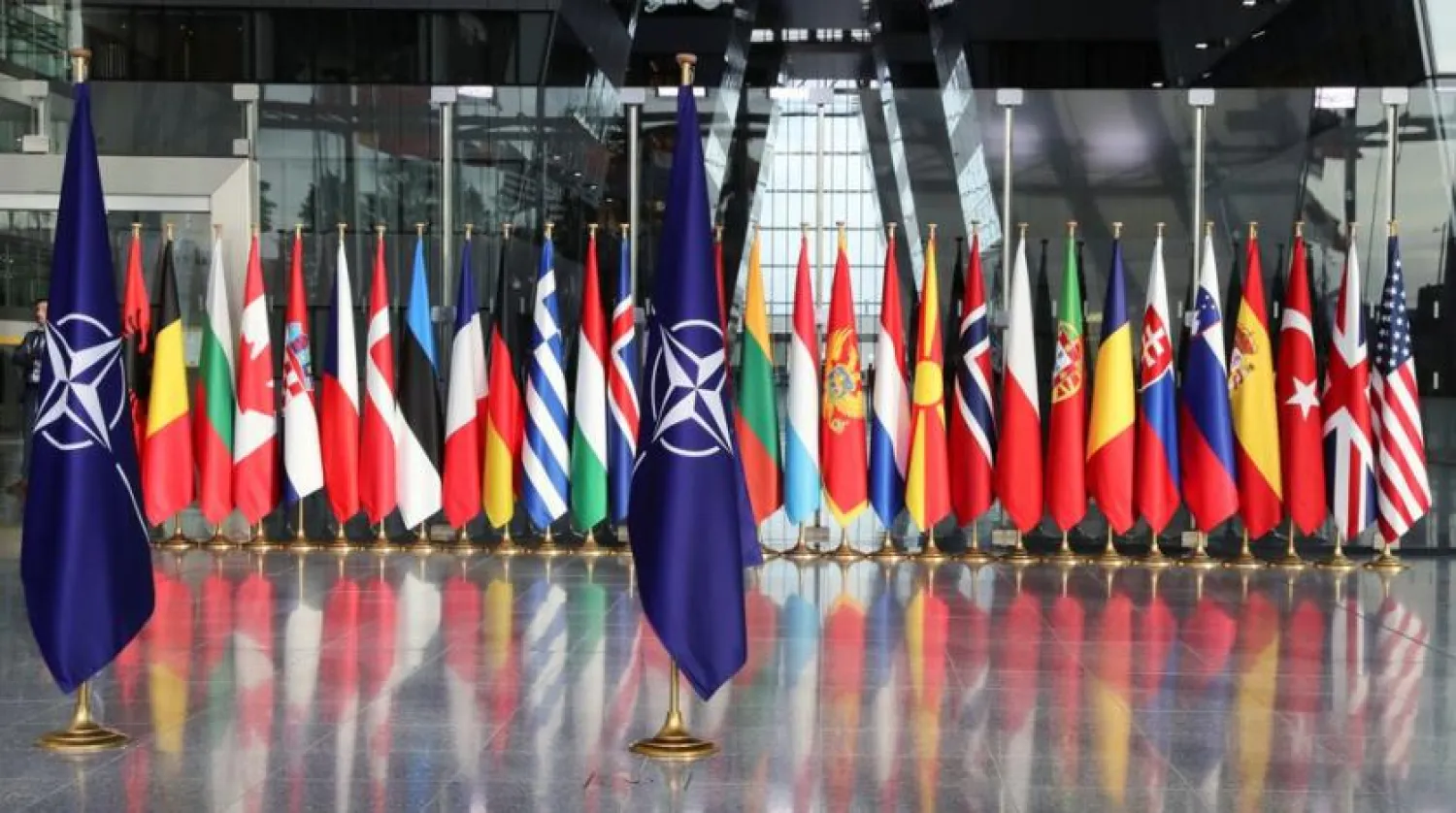 File Photo: Flags are seen ahead of a NATO Defense Ministers meeting at the Alliance headquarters in Brussels, Belgium, October 21, 2021. REUTERS/Pascal Rossignol
