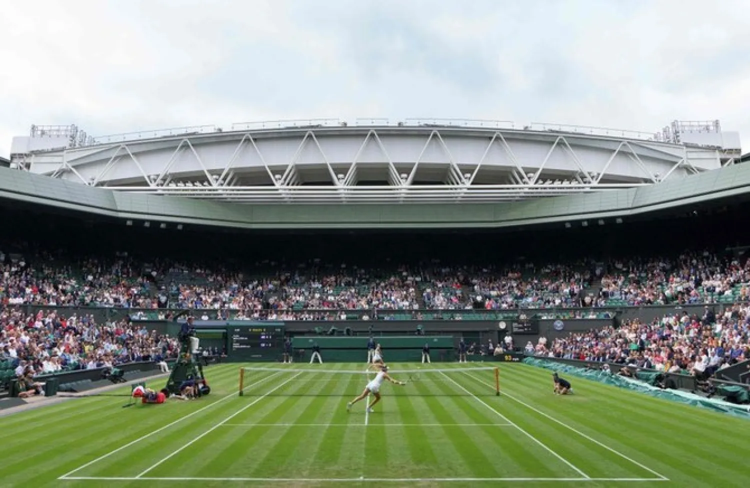 A general view of play on Center Court, with the roof open at The All England Tennis Club in Wimbledon in June 2021 (AFP/File)
