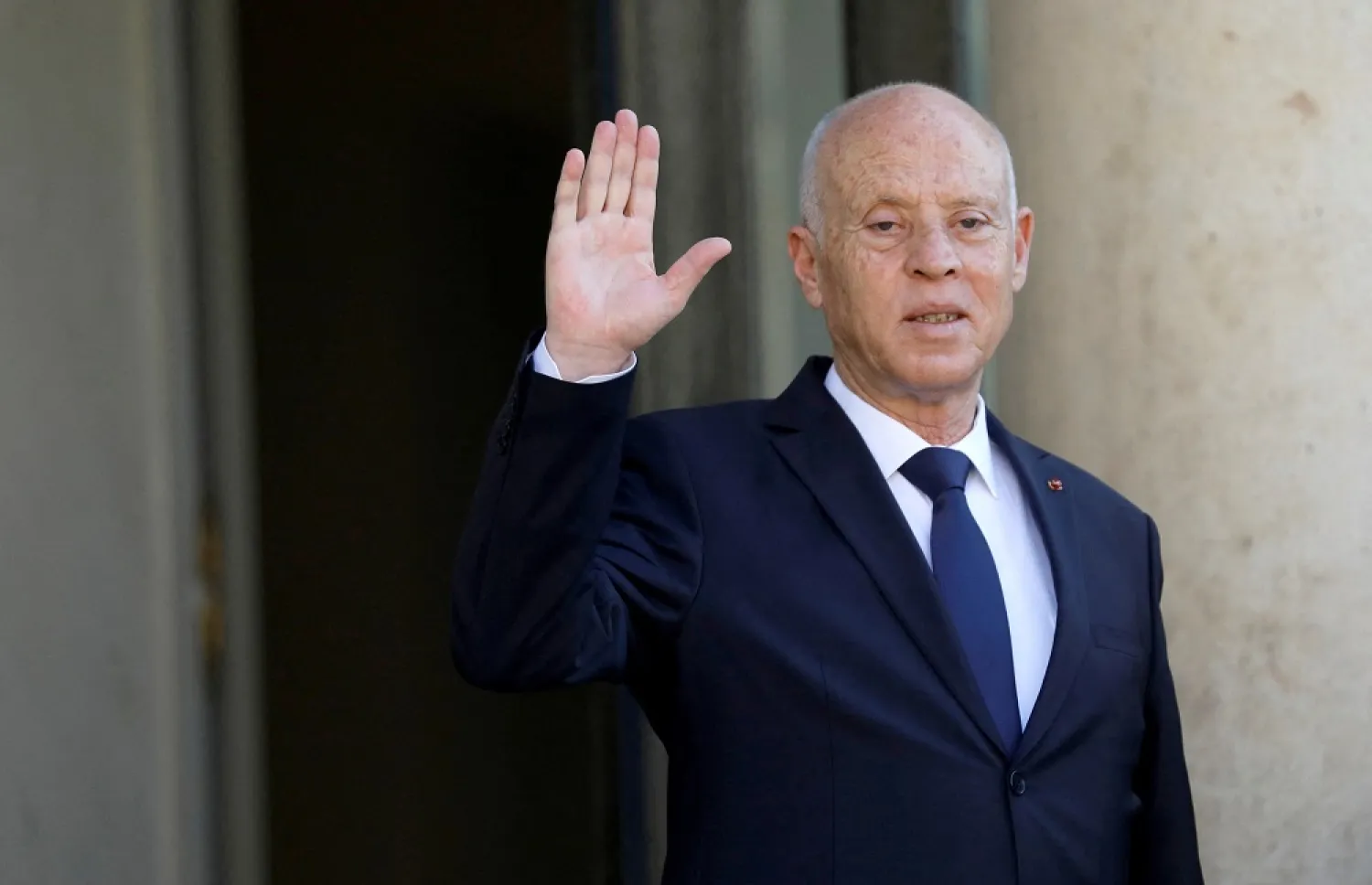 Tunisia's President Kais Saied waves as he is welcomed by French President Emmanuel Macron (not pictured) before a meeting at the Elysee Palace in Paris, France, June 22, 2020. (Reuters)