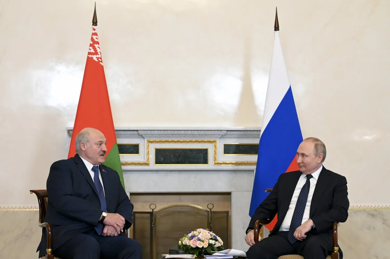 Russian President Vladimir Putin, right, listens to Belarusian President Alexander Lukashenko during their meeting in St. Petersburg, Russia, Saturday, June 25, 2022. (AP)