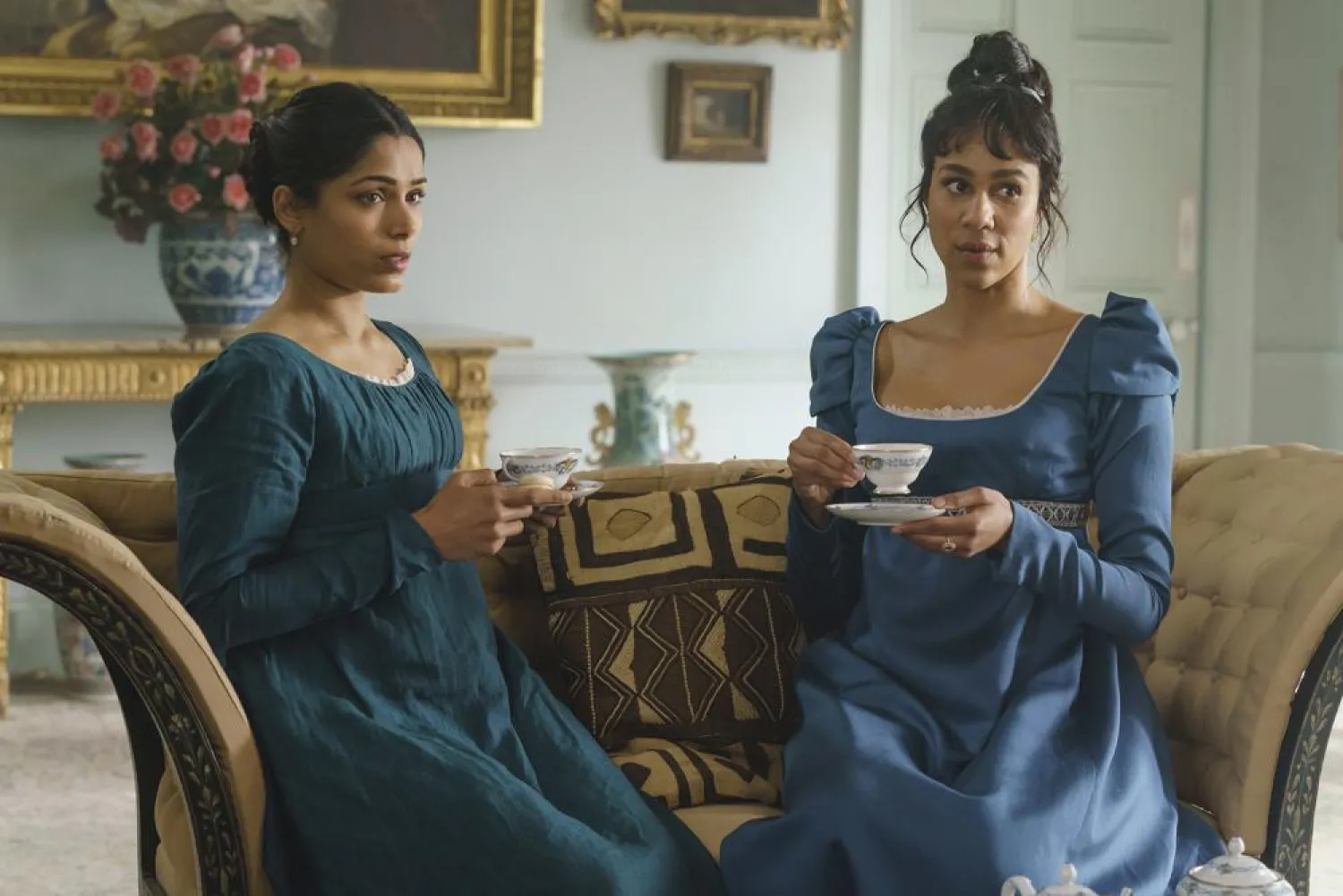 This image released by Bleecker Street shows Freida Pinto, left, and Zawe Ashton in a scene from "Mr. Malcolm's List." (Bleecker Street via AP)