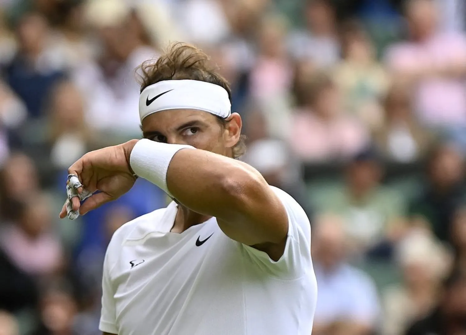 Tennis - Wimbledon - All England Lawn Tennis and Croquet Club, London, Britain - June 28, 2022 Spain's Rafael Nadal reacts during his first round match against Argentina's Francisco Cerundolo REUTERS/Toby Melville