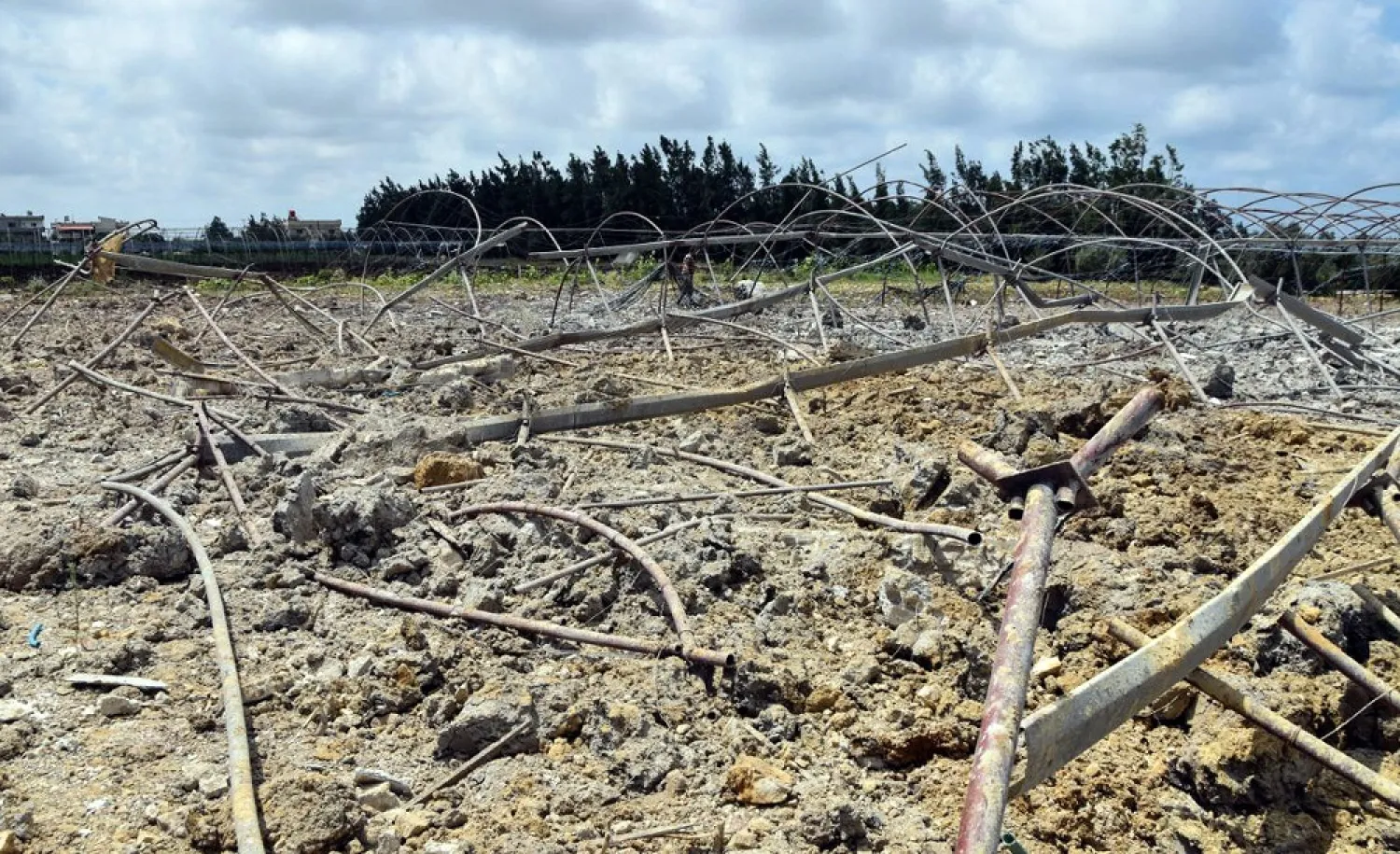 A handout picture released by the official Syrian Arab News Agency (SANA) on July 2, 2022, shows a crater caused by a reported Israeli air strike in the western Syrian coastal city of Tartus. (SANA/AFP)