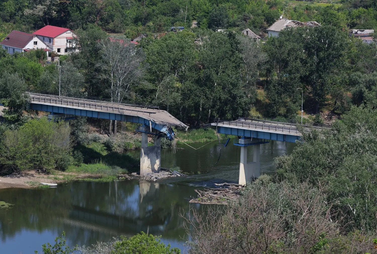  A view of the destroyed bridge linking Sievierodonetsk with Lysychansk, during Ukraine-Russia conflict, as seen from the city of Lysychansk in the Luhansk Region, Ukraine July 4, 2022. (Reuters)
