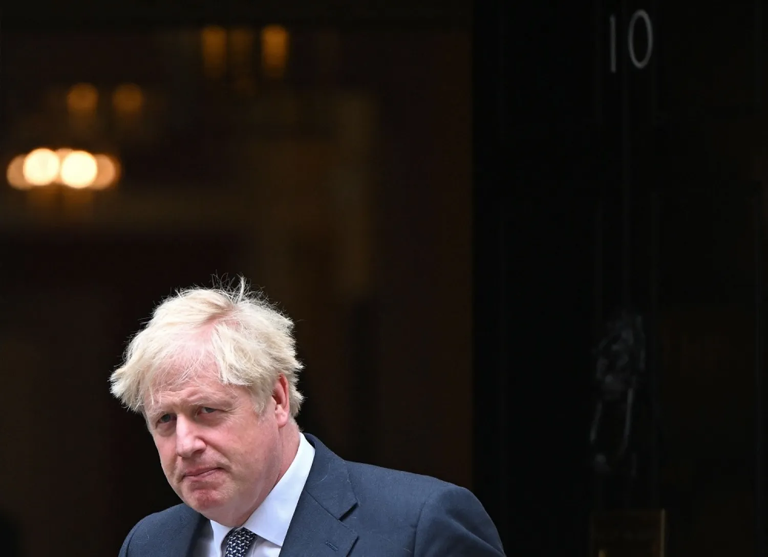Britain's Prime Minister Boris Johnson leaves from 10 Downing Street in central London on July 5, 2022. (AFP) 