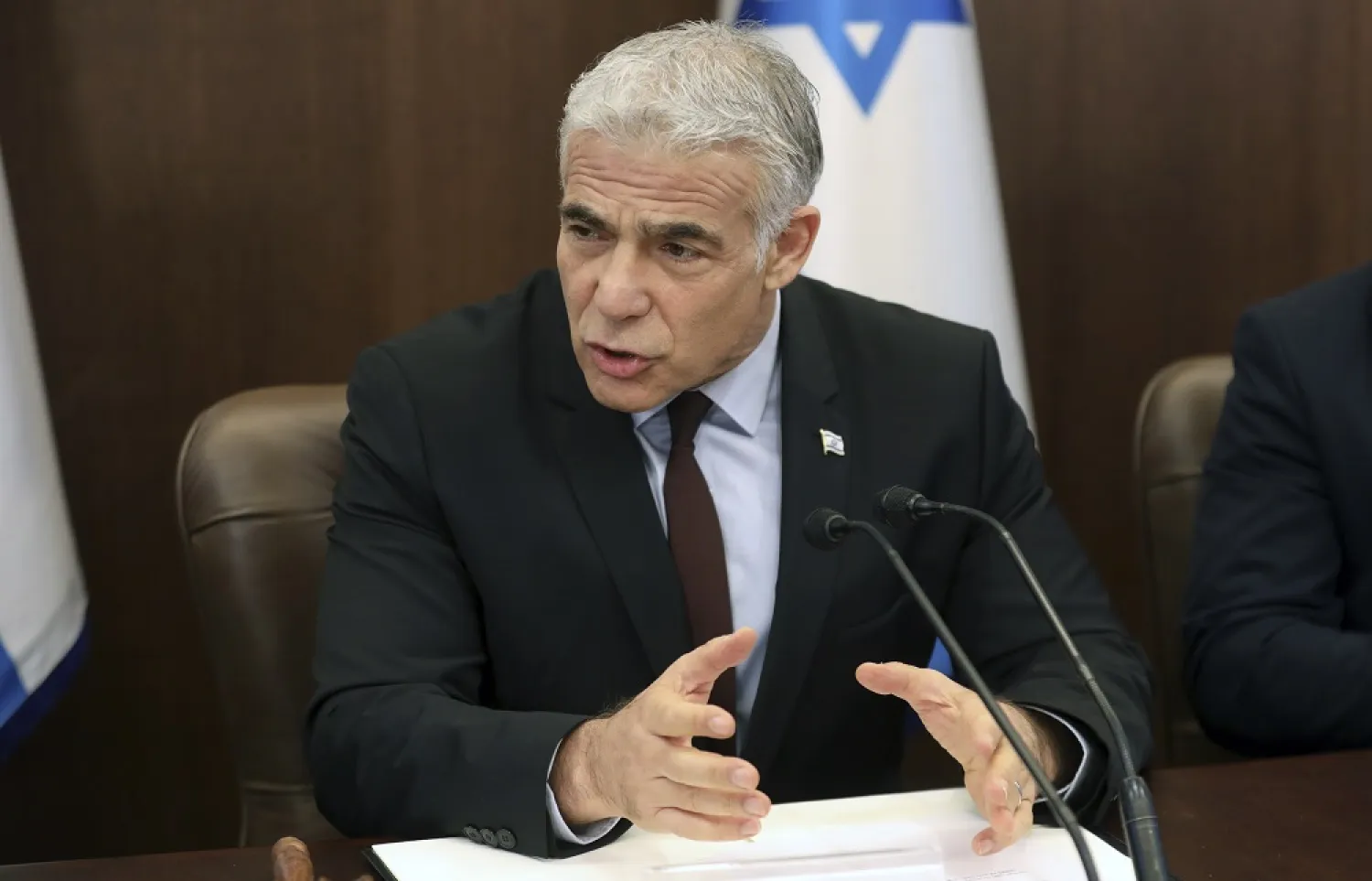 Israeli caretaker Prime Minister Yair Lapid chairs the first cabinet meeting days after lawmakers dissolved parliament, in Jerusalem, Sunday, July 3, 2022. (AP) 