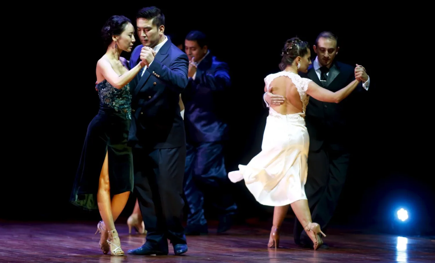 Victor Ho Jon Cho (2nd L) and Adelina Yoon Woo Kim from South Korea, who are representing the city of Seoul, dance during the Salon style final round at the Tango World Championship in Buenos Aires August 26, 2015. (Photo by Marcos Brindicci/Reuters)