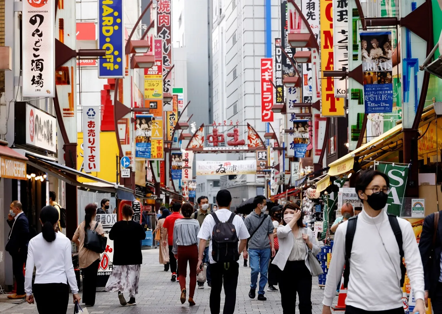 People make their way at Ameyoko shopping district in Tokyo, Japan, May 20, 2022. (Reuters)