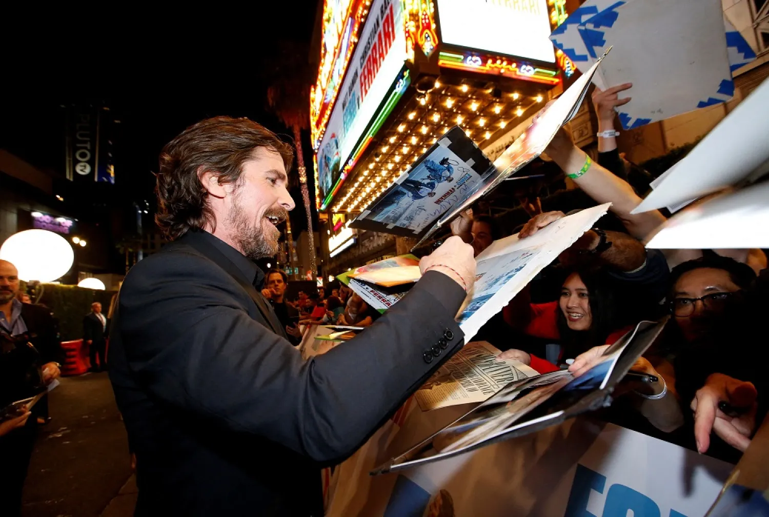 Cast member Christian Bale signs autographs at a special screening for the movie "Ford v Ferrari" in Los Angeles, California, US, November 4, 2019. (Reuters)
