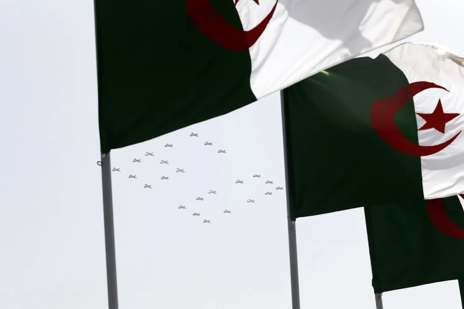 War planes fly to display the number 60 during a military parade to mark the 60th anniversary of Algeria's independence, Tuesday, July 5, 2022 in Algiers. (AP)
