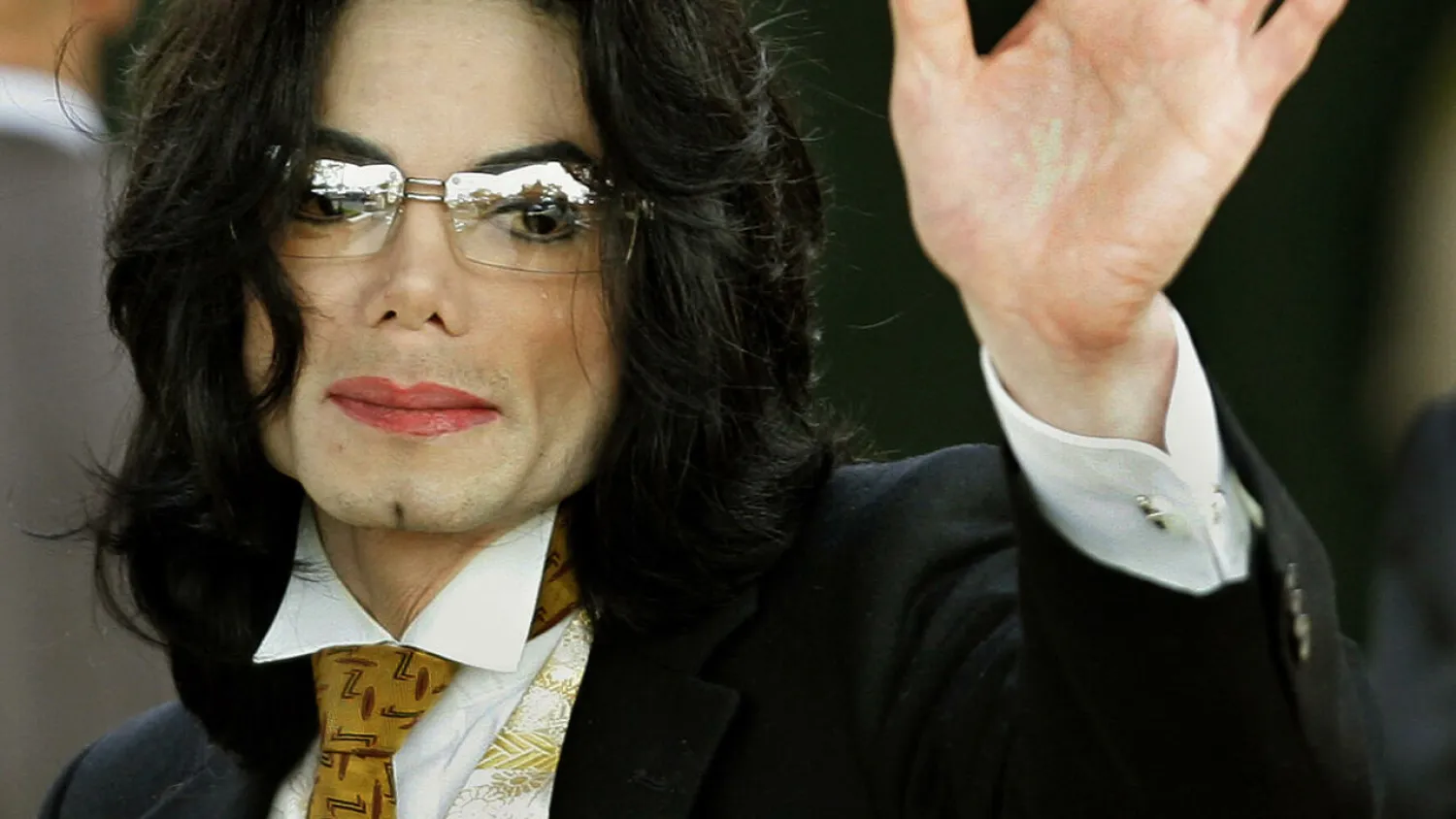 Michael Jackson waves as he arrives at the Santa Barbara County courthouse in June 2005, in Santa Maria, California TIMOTHY A. CLARY AFP/File
