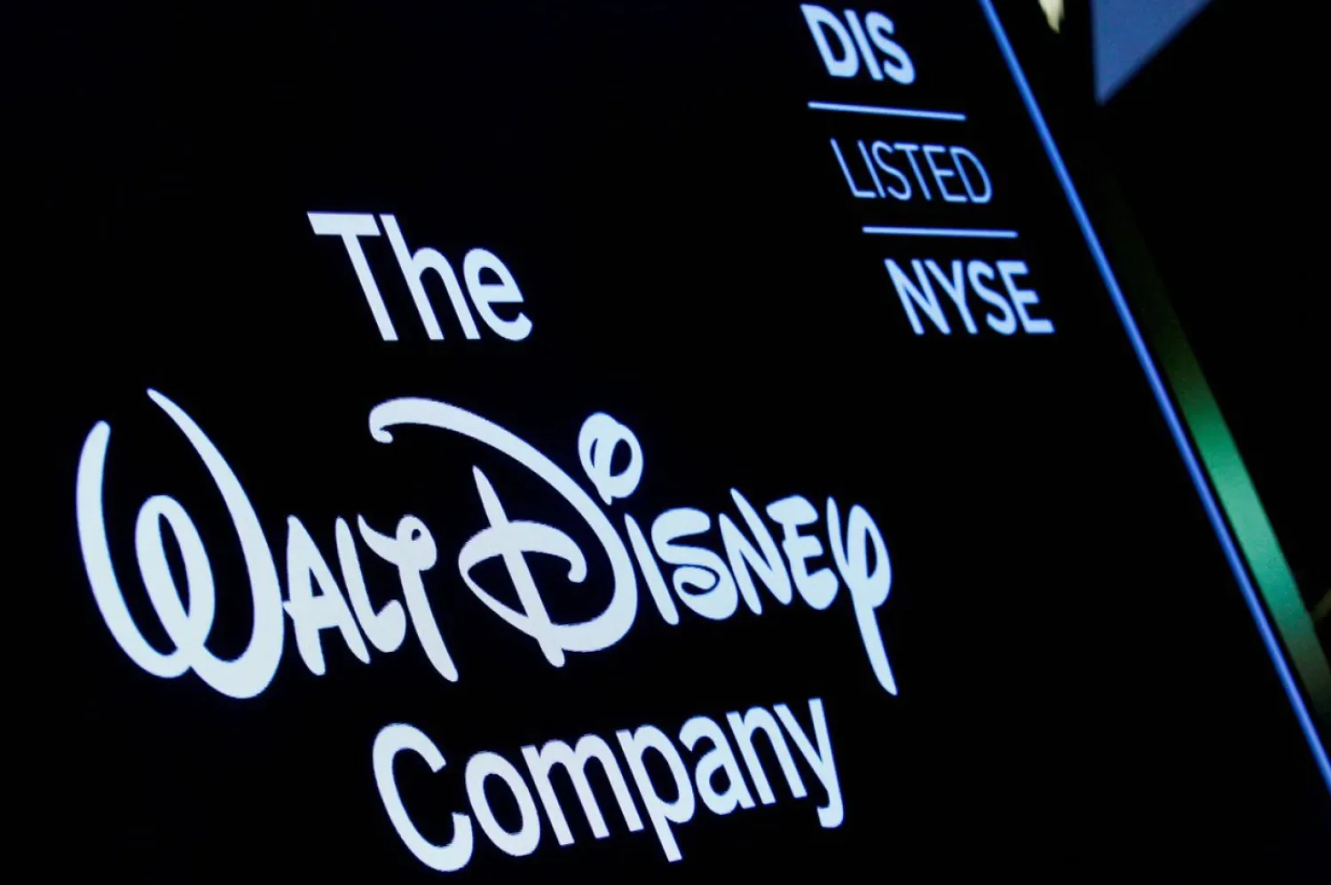 A screen shows the logo and a ticker symbol for The Walt Disney Company on the floor of the New York Stock Exchange (NYSE) in New York, U.S., December 14, 2017. REUTERS/Brendan McDermid/File Photo

