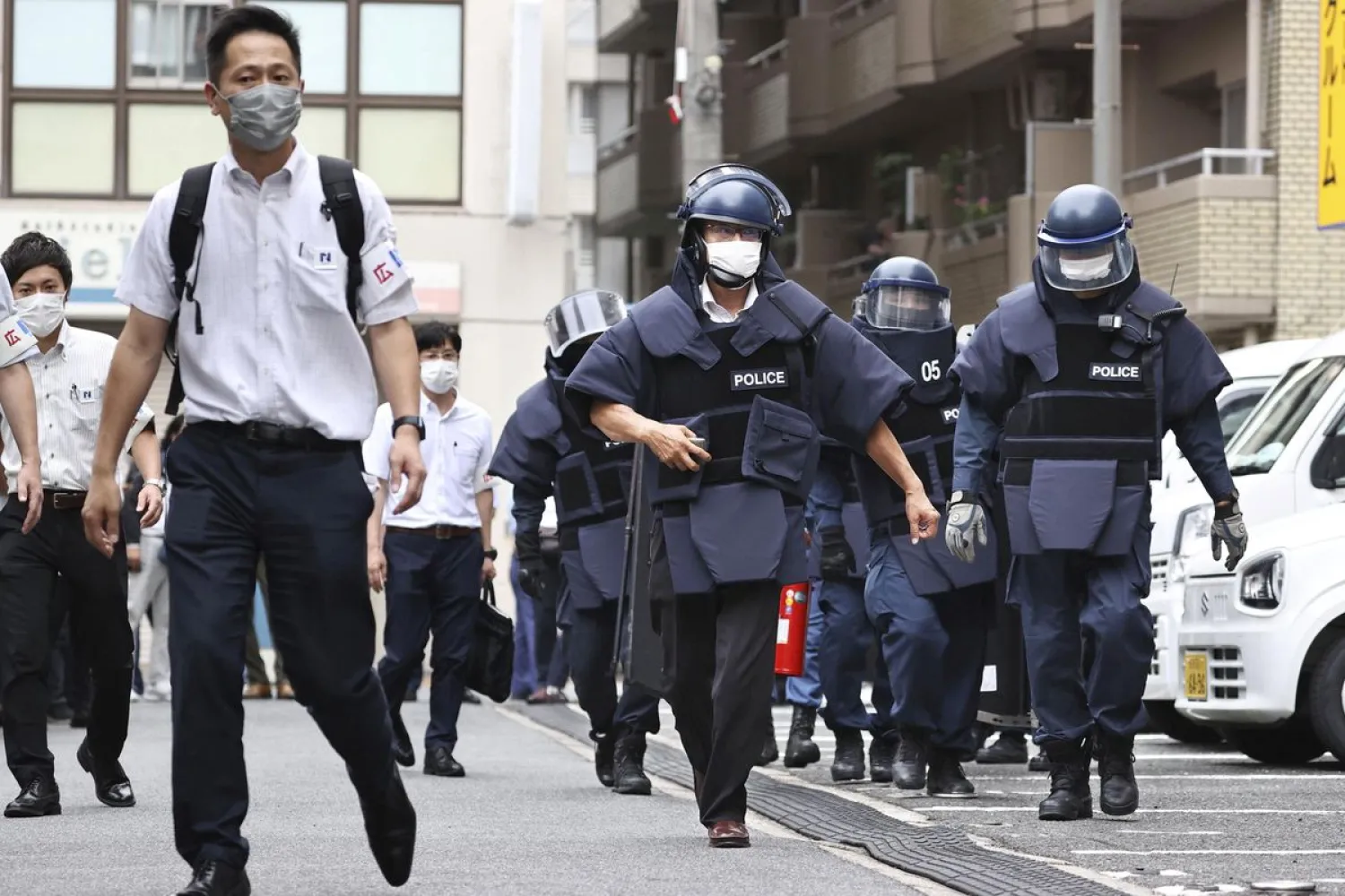Police investigators arrive at the residence of the suspect who was believed to have shot former Japanese Prime Minister Shinzo Abe, in Nara, Japan July 8, 2022 in this photo taken by Kyodo. Kyodo via REUTERS