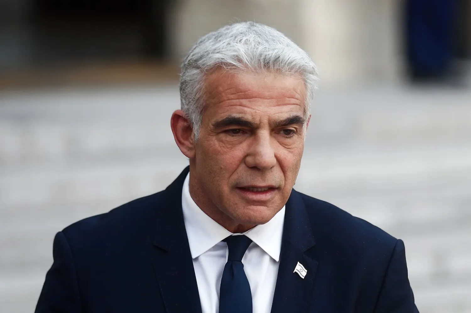 Israeli Prime Minister Yair Lapid speaks at a press conference with French President Emmanuel Macron (not pictured) at the Elysee Palace in Paris, France, 05 July 2022. (EPA)