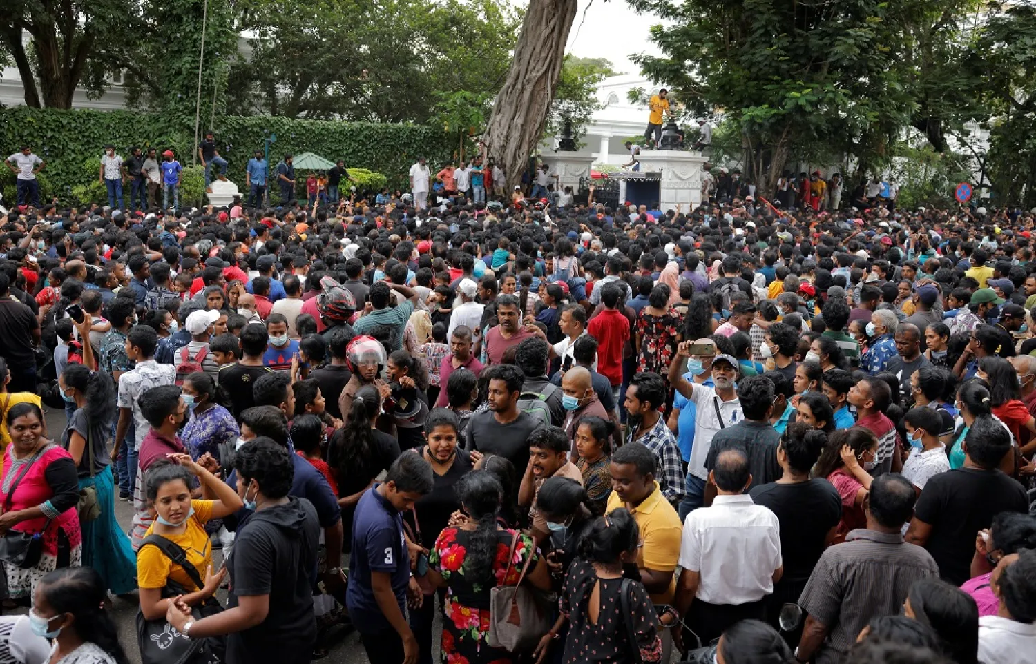 People wait to visit the President's house on the day after demonstrators entered the building, after President Gotabaya Rajapaksa fled, amid the country's economic crisis, in Colombo, Sri Lanka July 10, 2022. (Reuters)