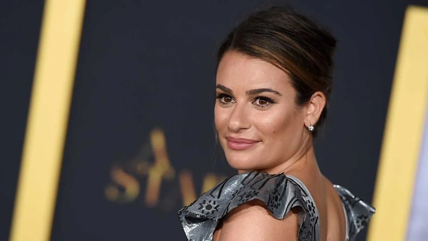 Lea Michele arrives at the Los Angeles premiere of "A Star Is Born" on Monday, Sept. 24, 2018, at the Shrine Auditorium. (AP)