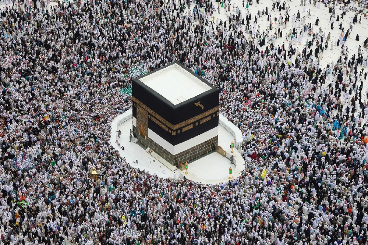 Worshippers perform the farewell tawaf (circumambulation) in the holy Saudi city of Makkah on July 11, 2022, marking the end of this year's Hajj. (AFP)
