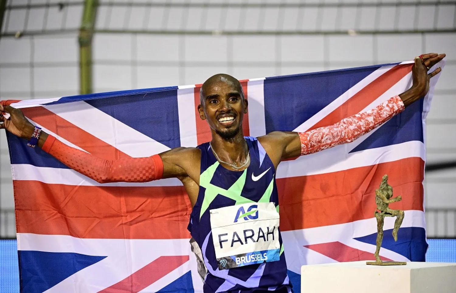In this file photo taken on September 5, 2020 Britain's Mo Farah celebrates after victory and a world record in the men's one hour event at The Diamond League AG Memorial Van Damme athletics meeting at The King Baudouin Stadium in Brussels. (AFP)